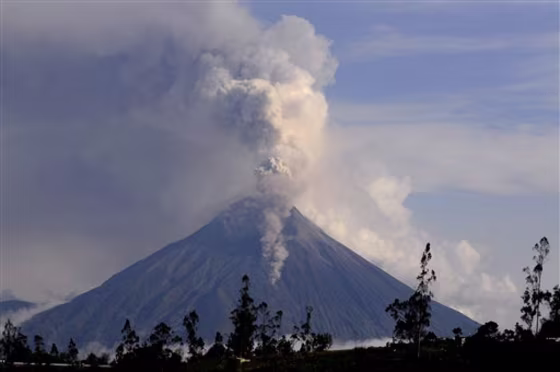 A column of smoke and ash spews out from the Tungurahua volcano in Pelileo, Ecuador, on Saturday.